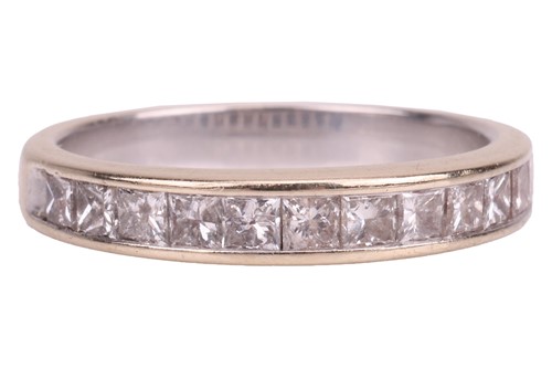 Lot 60 - A princess-cut diamond half eternity ring in...