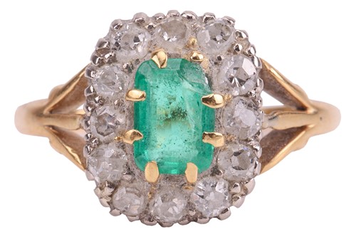 Lot 186 - An emerald and diamond cluster ring, centred...