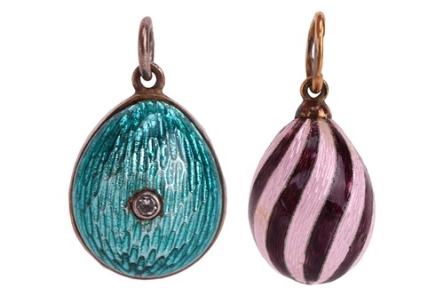 Lot 7 - Two Russian guilloche enamel egg charms; the...