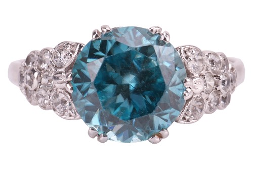 Lot 72 - A blue zircon dress ring, centred with a...