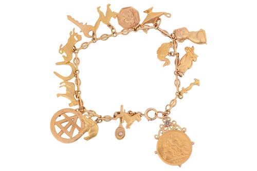 Lot 27 - A charm bracelet, comprising a fancy link...