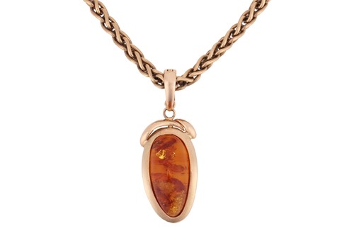 Lot 92 - An amber pendant on chain; featuring an oblong...