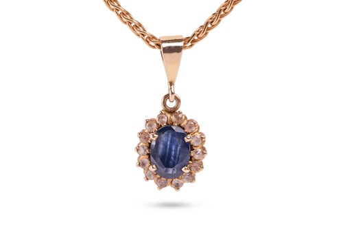 Lot 134 - A gem-set cluster pendant; comprising a...