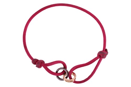 Lot 77 - Cartier - a 'Love Charity' bracelet, featuring...