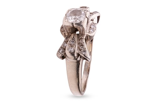 Lot 143 - A diamond-set ring, of stylised bow form,...