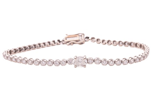 Lot 201 - A diamond-set tennis bracelet; featuring a...