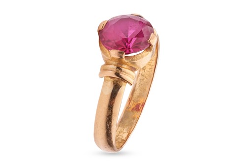 Lot 30 - A synthetic ruby dress ring: featuring an oval-...