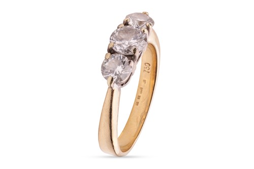 Lot 116 - A diamond trilogy ring; comprising a central...