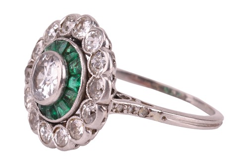 Lot 240 - An Art Deco diamond and emerald target ring,...