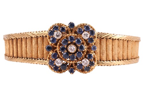 Lot 99 - A sapphire and diamond bracelet, centred by a...