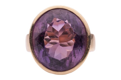 Lot 42 - An amethyst solitaire ring, featuring an...