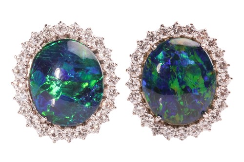 Lot 199 - A pair of opal doublet and diamond halo...