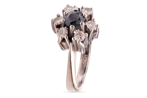 Lot 212 - A sapphire and diamond cluster ring,...