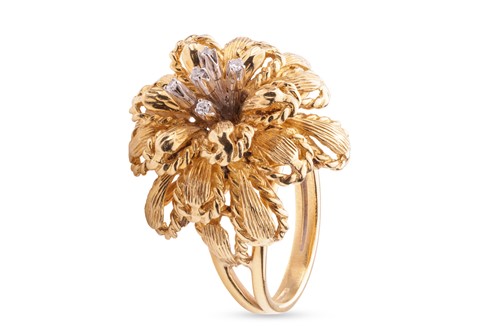 Lot 16 - A diamond-set floral cocktail ring, the tiered...