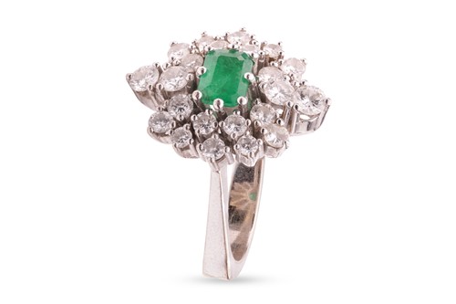 Lot 36 - An emerald and diamond-set cluster ring,...