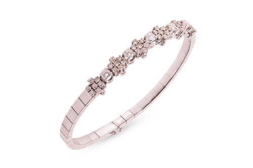 Lot 214 - A diamond-set bracelet, comprising five round...