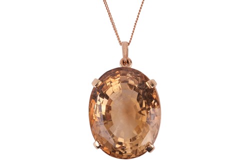 Lot 193 - A citrine pendant, featuring an oval mixed-cut...