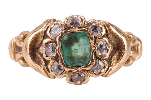 Lot 76 - An emerald and diamond cluster ring,...