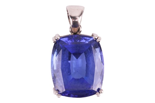 Lot 153 - A large tanzanite pendant, the cushion-cut...