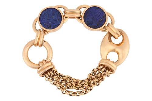 Lot 102 - A fancy link bracelet set with carved lapis...