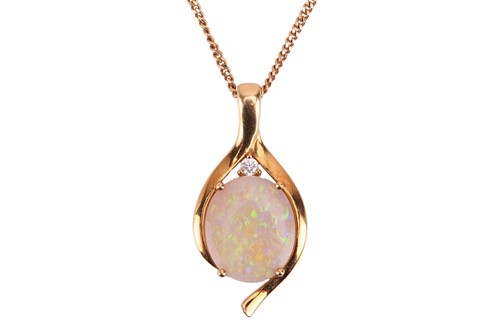 Lot 174 - An opal pendant on chain, consisting of an...