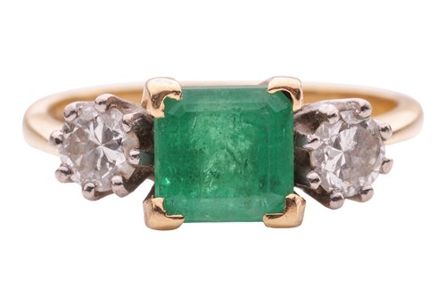 Lot 167 - An 18ct gold emerald and diamond trilogy ring,...