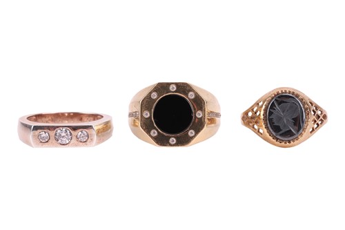 Lot 323 - Three gentlemen's rings; comprising a hematite...