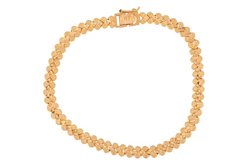 Lot 206 - A fancy link bracelet, comprising a series of...