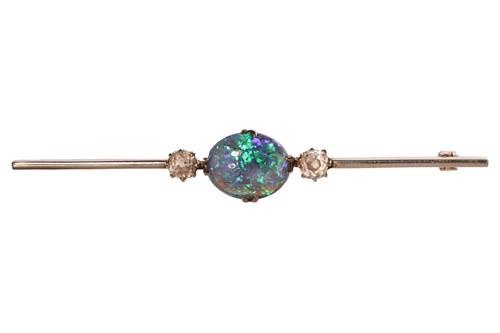 Lot 197 - An opal and diamond bar brooch, centred with...