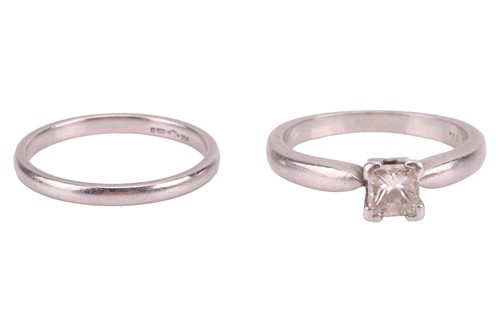 Lot 69 - A princess-cut diamond solitaire and wedding...