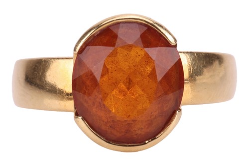 Lot 224 - A citrine dress ring, comprising a central...