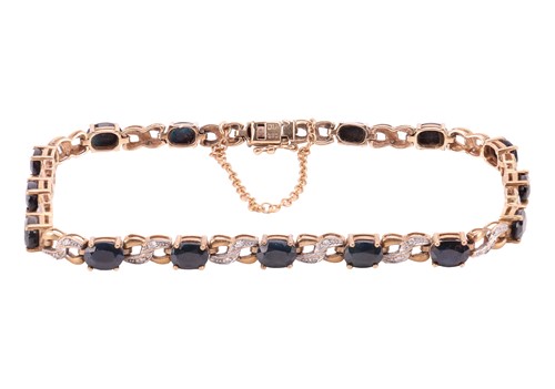 Lot 134 - A sapphire and diamond-set line bracelet,...