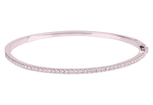 Lot 160 - A diamond-set hinged bangle in platinum, with...