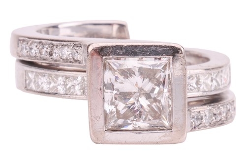 Lot 248 - A princess-cut diamond solitaire ring in 18ct...