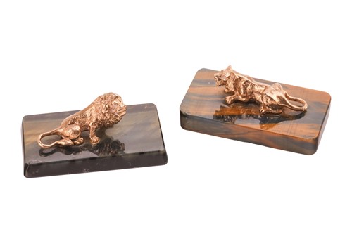 Lot 141 - A pair of lion sculptures on tiger's eye...