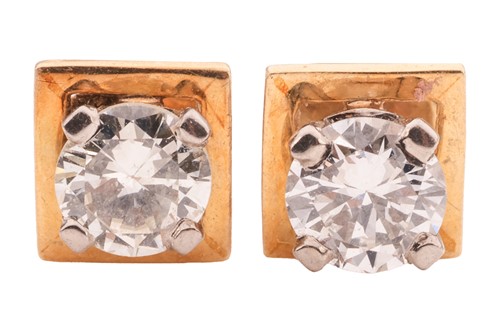 Lot 164 - A pair of diamond stud earrings, with an...