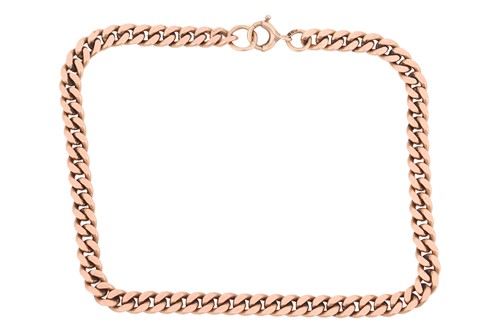 Lot 101 - A flat curb link bracelet in 9ct gold,...