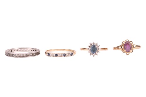 Lot 217 - Four gem-set rings; comprising a sapphire and...