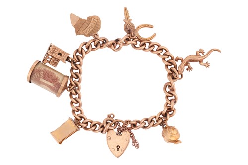 Lot 152 - A 9ct gold charm bracelet, the curb link chain...