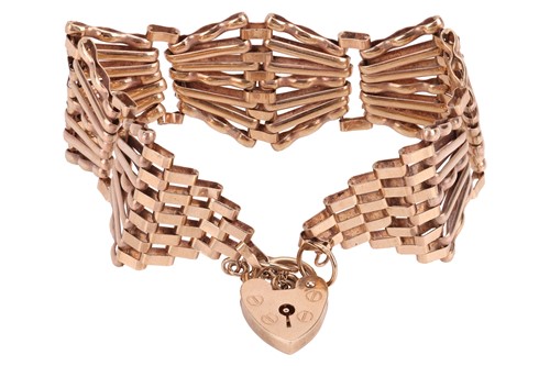 Lot 144 - A fancy gate link bracelet in 9ct yellow gold,...