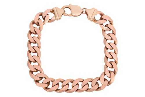 Lot 243 - A flat curb link bracelet in 9ct gold,...