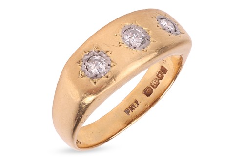 Lot 22 - A three-stone diamond ring in 18ct gold,...