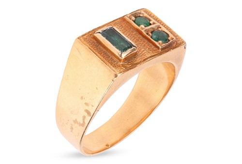 Lot 145 - An emerald-set dress ring, the rectangular...