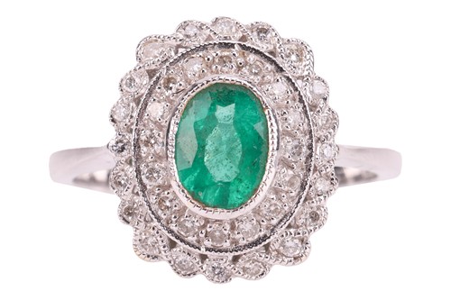 Lot 4 - An emerald and diamond panel ring, centred...