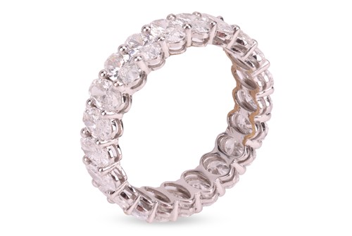 Lot 186 - A laboratory-grown diamond eternity ring, with...
