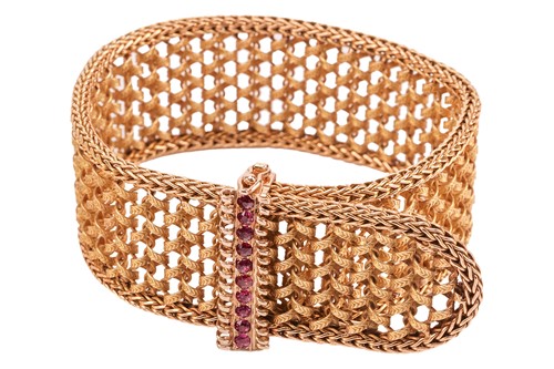 Lot 51 - A ruby-set woven jarretière bracelet, retailed...