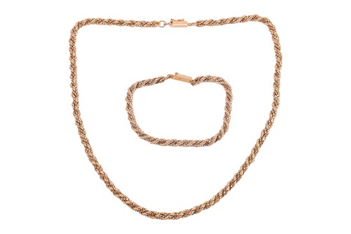 Lot 53 - A two-toned twisted rope necklace and bracelet...