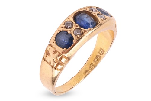Lot 69 - An Edwardian sapphire and diamond half-hoop...