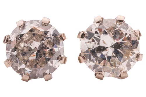 Lot 142 - A pair of diamond stud earrings, each...