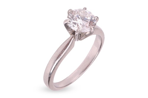 Lot 197 - A diamond solitaire ring, centred with a round...